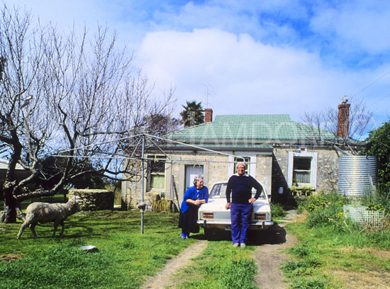 Mavis and Les Golder with ''mower'' the sheep at their Kingscote residence, Kangaroo Island, South Australia