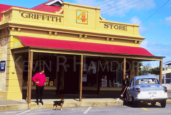 Chris and son, Nathan Ley with Roger the dog and the family's classic 1962 Morris Major Elite car (''the flea'') parked in front of Griffith's old fashioned grocery store on Dauncey Street, Kingscote, Kangaroo Island, South Australia