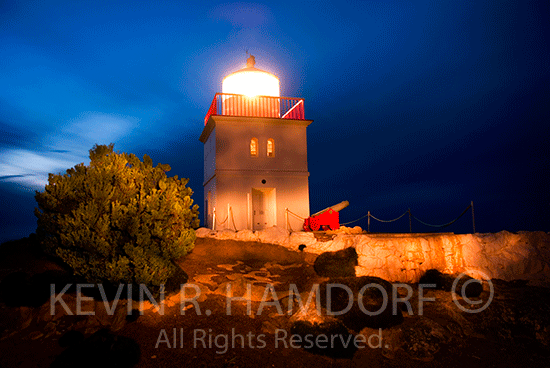 Cape Borda Lighthouse nightscape.  The lighthouse ommenced operation on the 13th July 1858 and is the third oldest lighthouse in South Australia and one only three square lighthouses in Australia.  The light was manually operated until 1989, when automation took place.  Note the old signal cannon in the foreground.  Northwest coast, Flinders Chase National Park, Kangaroo Island, South Australia.
